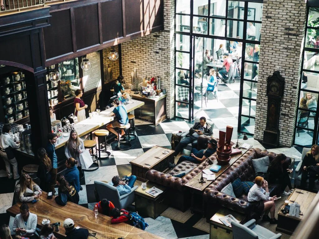 people sitting in a cosy cafe some of them have ms and adhd